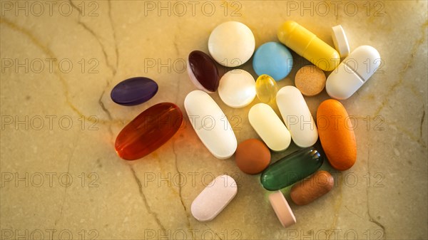 Pills and capsules on marble