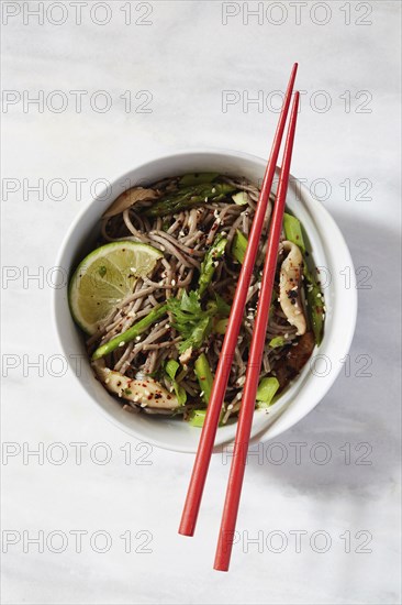 Asian meal in bowl with chopsticks,,