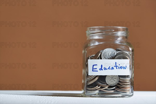 Coins in jar collected for education