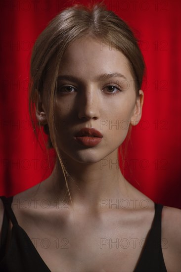 Portrait of young woman with blond hair