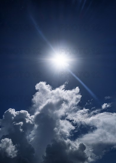 White clouds and sun on blue sky