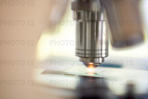 Close-up of laboratory microscope lens