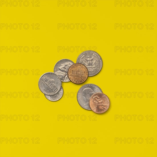 American coins on a yellow background