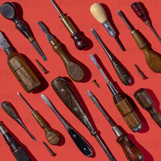 Vintage screwdrivers on red background