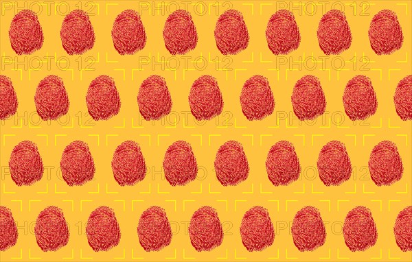 Red fingerprints on yellow background