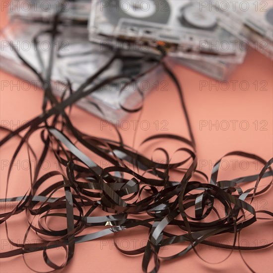 Analog audio cassettes on orange background