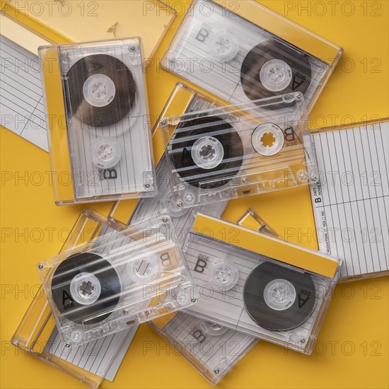 Analog audio cassettes on yellow background