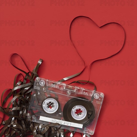 Analog audio cassette on red background