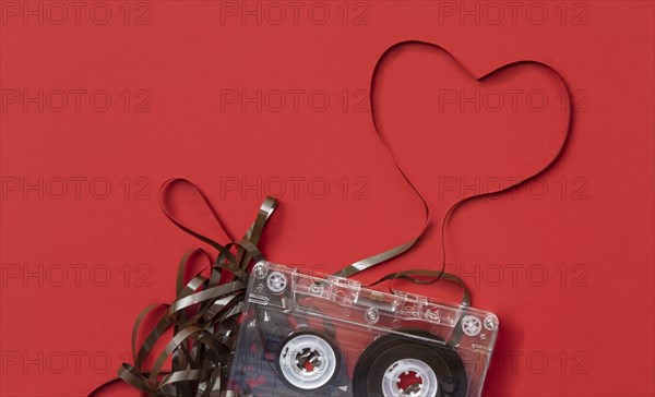 Analog audio cassette on red background