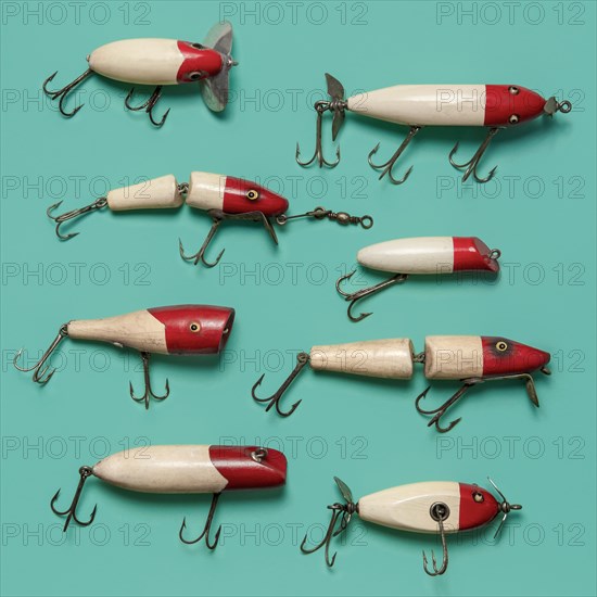 Antique fishing lures on blue background