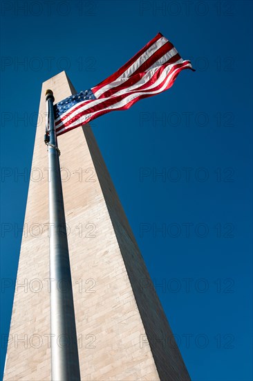 USA, Washington D.C., Washington monument and American flag