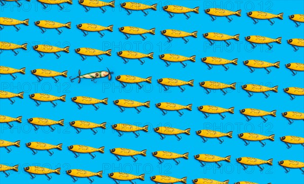 Vintage fishing lures on blue background