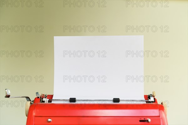 Typewriter with blank sheet of paper