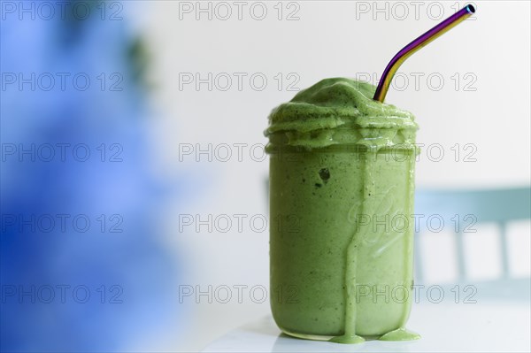 Green smoothie with straw
