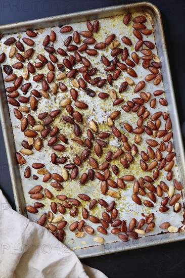 Roasted almonds on baking sheet