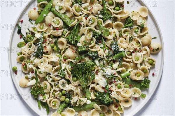 Orecchiette with broccoli and peas on plate