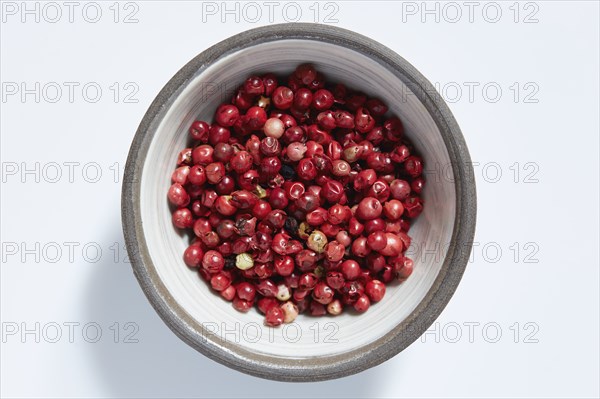 Red peppercorns in bowl