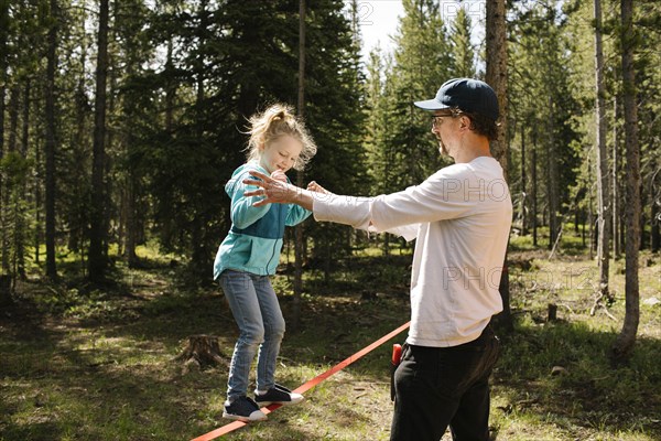 Father assisting daughter