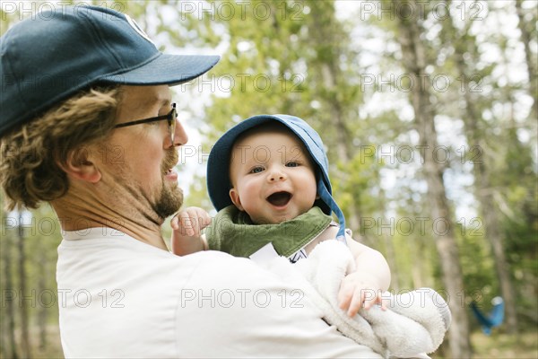 Father holding baby son