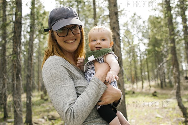 Portrait of smiling woman with baby son