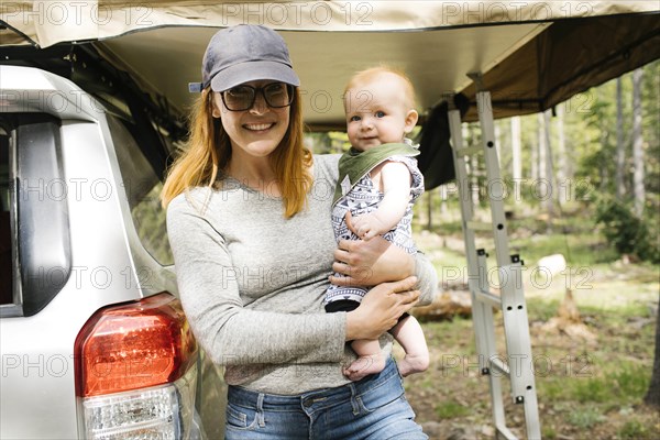 Portrait of smiling woman with baby son