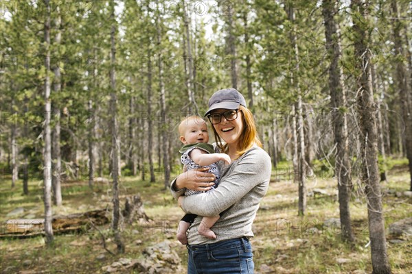 Portrait of smiling woman holding baby son