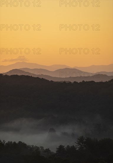 USA, Georgia, Orange sky above Blue Ridge Mountains at sunrise