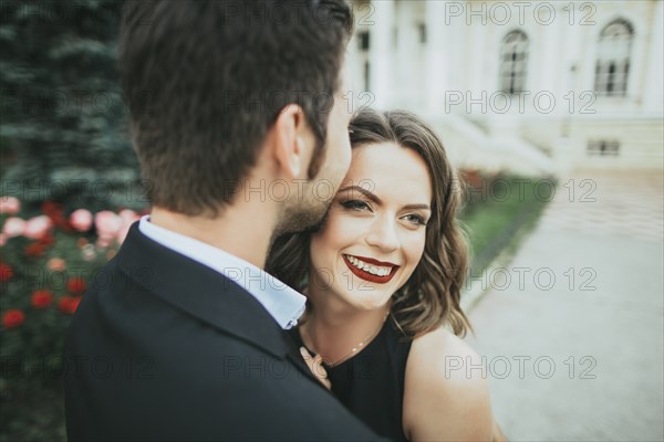 Ukraine, Couple embracing in garden