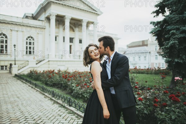 Ukraine, Couple embracing in garden