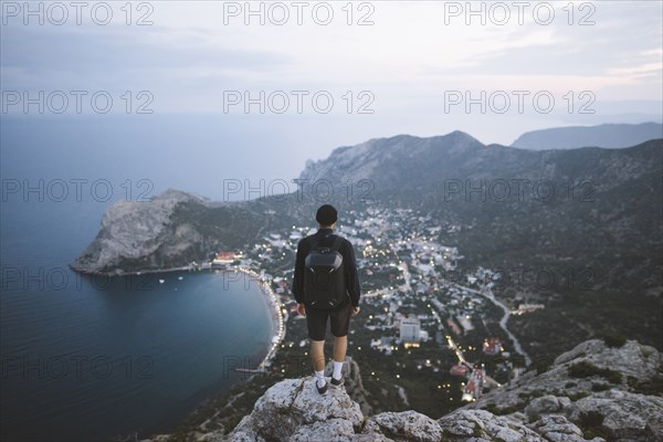 Italy, Liguria, La Spezia, Man looking at mountain range from mountain top