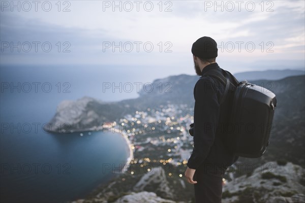 Italy, Liguria, La Spezia, Man looking at mountain range from mountain top