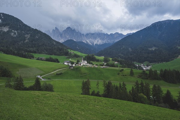 Italy, South Tyrol, Funes, Santa Magdalena, Landscape with village in valley