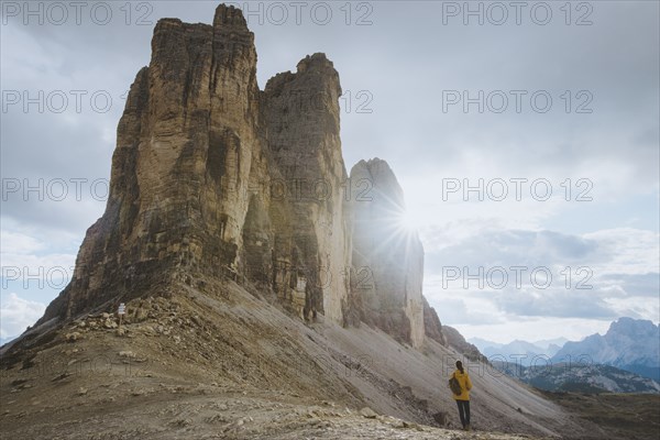 Italy, South Tirol, Sexten Dolomites, Tre Cime di Lavaredo, Woman looking at rock formations