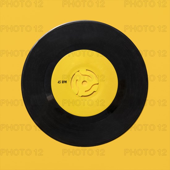 Vintage record on yellow background