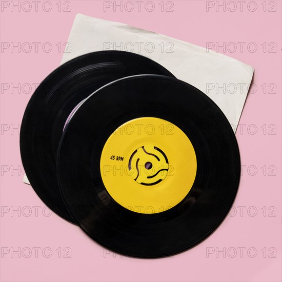 Vintage records on pink background