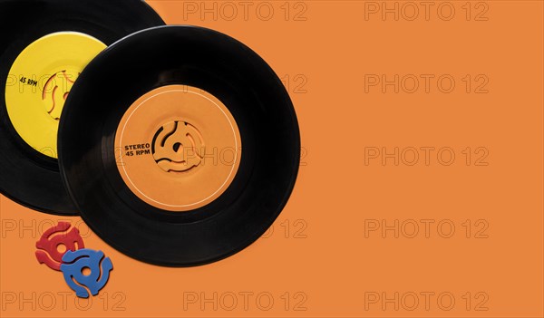 Vintage records on orange background