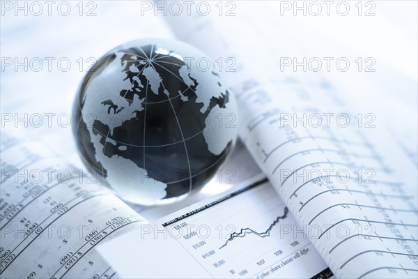 Glass globe an financial documents