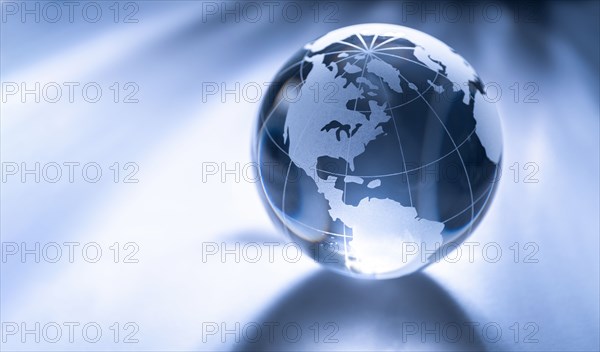 Glass globe on gray background