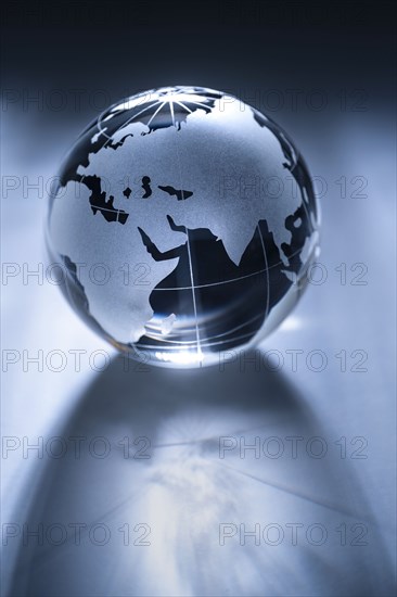 Glass globe on gray background