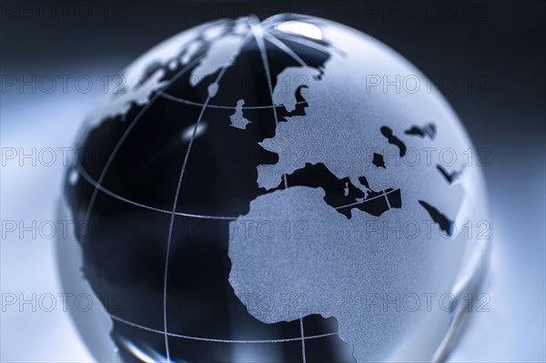 Glass globe on gray background