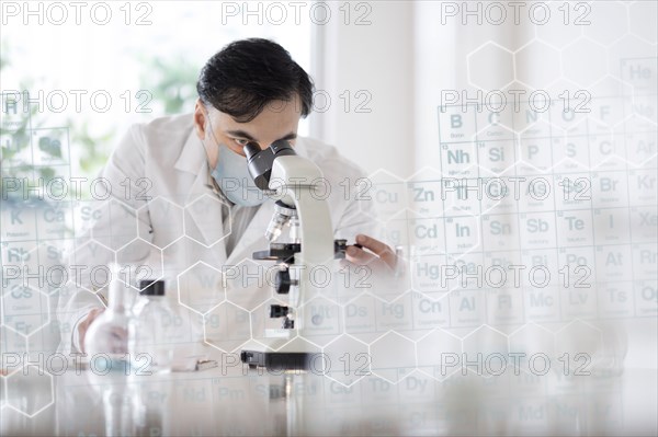 Doctor using microscope