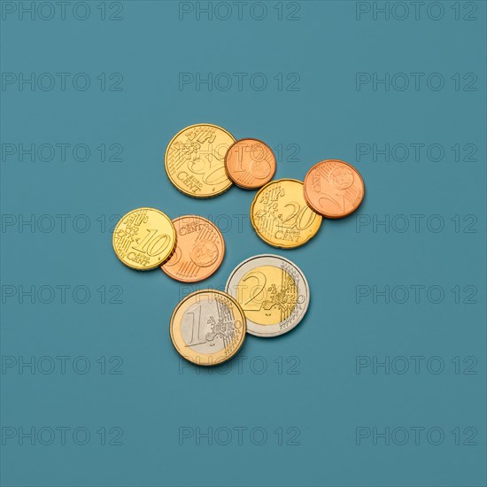 Euro coins on blue background
