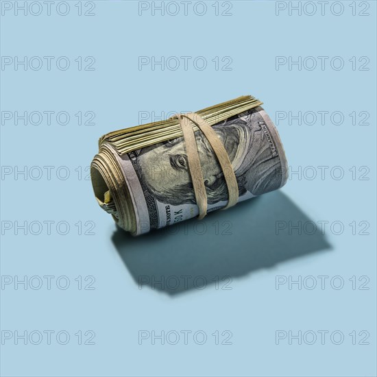 Roll of US dollar bills