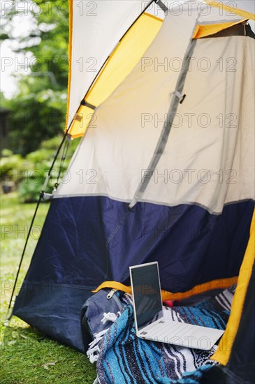 Tent and laptop in garden
