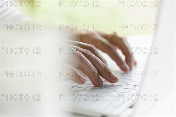 Woman's hands on laptop