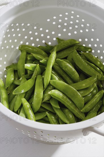 Green peas in colander