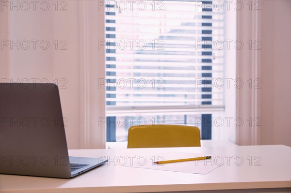 Laptop on desk at home school