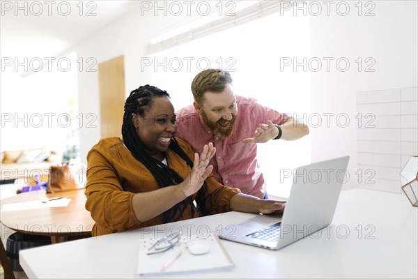 Man and woman during zoom call at home