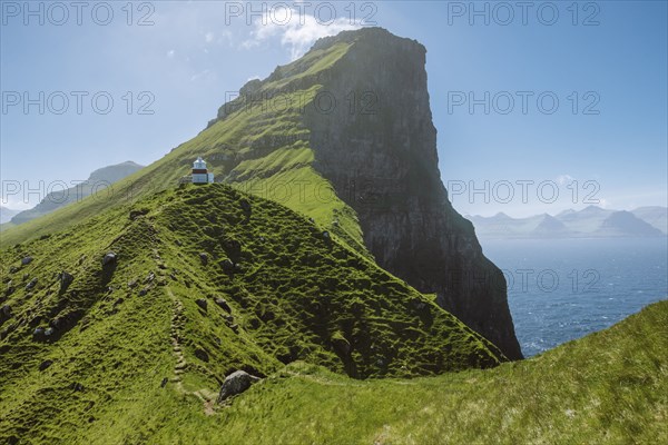 Denmark, Faroe Islands, Klaksvik, Trollanes, Kallur Lighthouse on sunny day