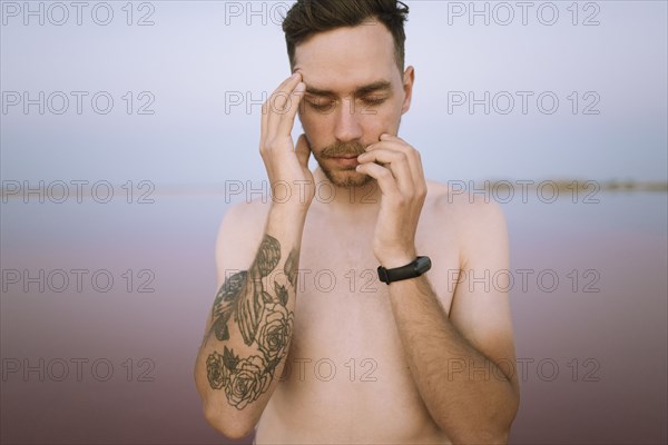 Portrait of shirtless young man